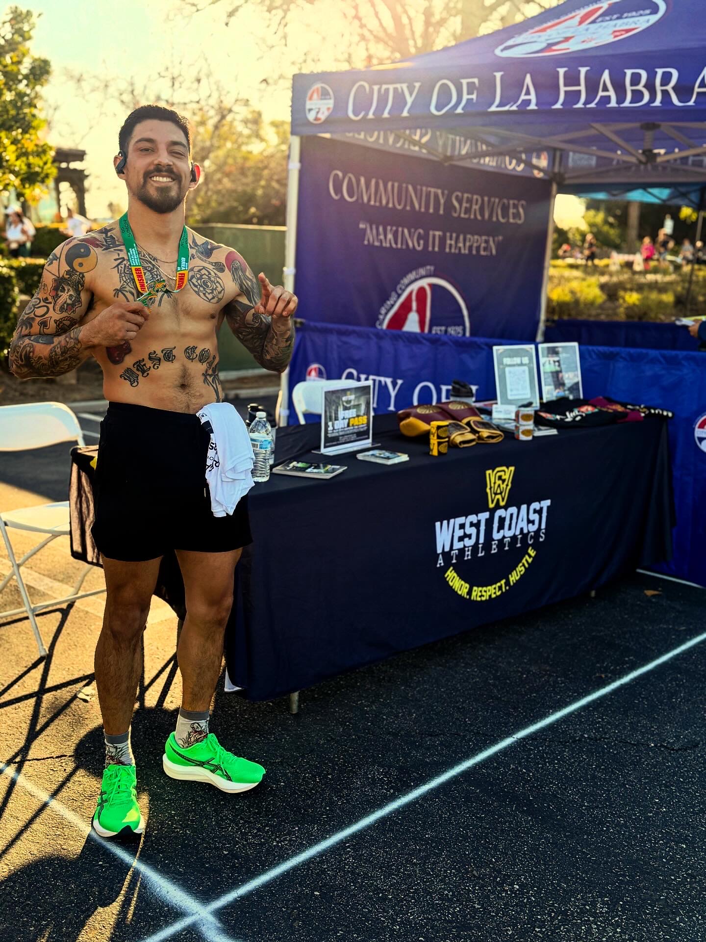 West Coast Athletics at the Brea 8K expo table